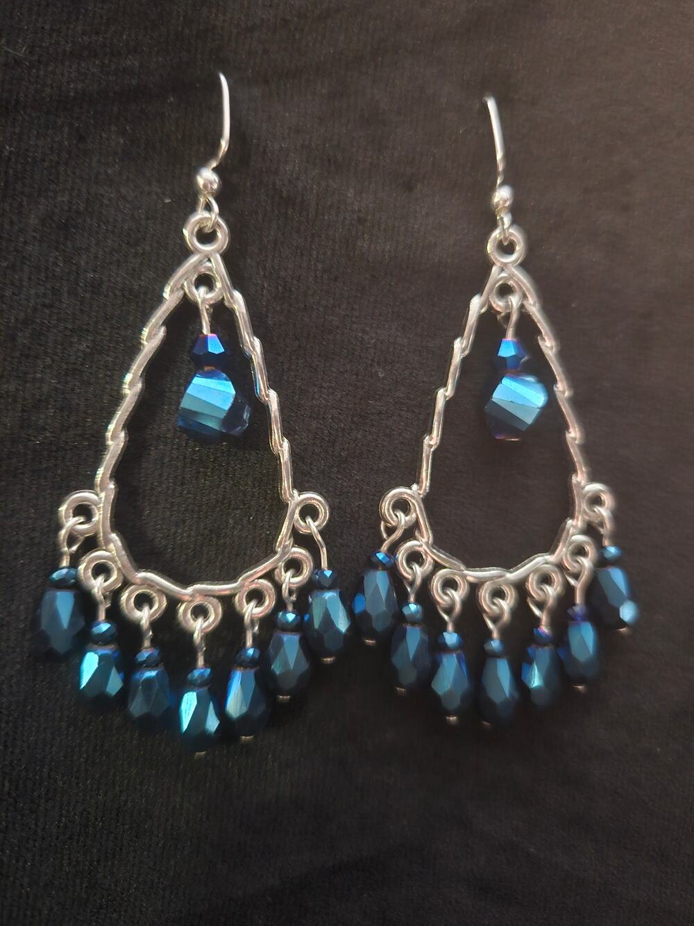 Silver twisted teardrop and blue metallic beaded chandelier earrings